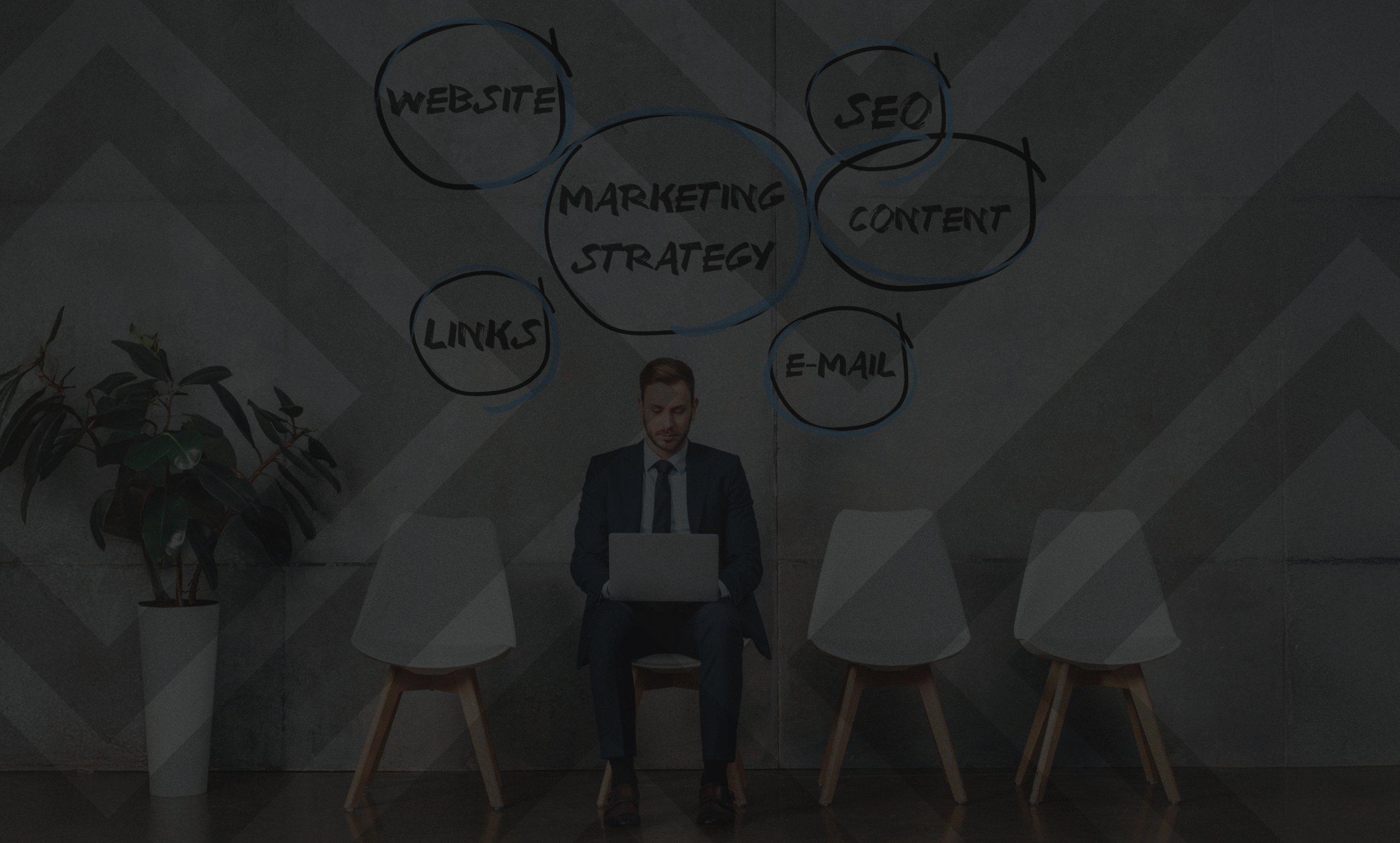 smiling-businessman-sitting-on-chair-and-using-lap-2024-11-17-23-32-59-utc